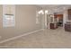 Dining area with natural light and an open view of the kitchen and appliances at 17886 W Brookwood Dr, Goodyear, AZ 85338
