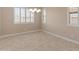 Bright dining room featuring plantation shutters and a modern chandelier at 17886 W Brookwood Dr, Goodyear, AZ 85338