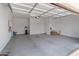 Spacious garage with water heater, water filtration system, and ample room for parking and storage at 17886 W Brookwood Dr, Goodyear, AZ 85338