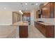 Beautiful kitchen featuring stainless steel appliances, granite countertops, and a large island perfect for entertaining at 17886 W Brookwood Dr, Goodyear, AZ 85338