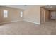 Bright and airy living room with tiled floors and multiple windows for natural light at 17886 W Brookwood Dr, Goodyear, AZ 85338