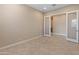 Open-concept space featuring neutral paint and tile flooring at 17886 W Brookwood Dr, Goodyear, AZ 85338
