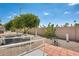 This backyard features desert landscaping, including mature lemon trees and a cactus garden at 205 S Higley Rd # 293, Mesa, AZ 85206