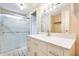 Bright bathroom showcasing vanity with chrome hardware, quartz countertop and walk-in shower at 205 S Higley Rd # 293, Mesa, AZ 85206