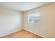 A bright and airy bedroom featuring a window with wood-look flooring at 205 S Higley Rd # 293, Mesa, AZ 85206