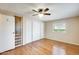 An open bedroom features a ceiling fan, built-in storage, and a sliding closet door at 205 S Higley Rd # 293, Mesa, AZ 85206
