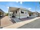 Charming home with a covered patio and drought-resistant rock landscaping and sidewalk at 205 S Higley Rd # 293, Mesa, AZ 85206
