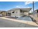 Well-maintained single story home with covered parking and minimalist rock landscaping at 205 S Higley Rd # 293, Mesa, AZ 85206