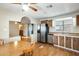 Charming kitchen with stainless steel appliances, wood cabinets, and adjacent dining area for convenient meals at 205 S Higley Rd # 293, Mesa, AZ 85206