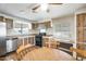Well-equipped kitchen with stainless steel appliances, wooden cabinets, and a adjacent dining area at 205 S Higley Rd # 293, Mesa, AZ 85206