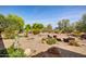 Backyard featuring a patio, seating and lush landscaping at 21384 E Excelsior Ave, Queen Creek, AZ 85142