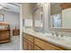 Bathroom with double sinks, cabinets and mirrors at 21384 E Excelsior Ave, Queen Creek, AZ 85142