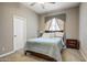 Bedroom with queen bed, carpet, window and night stand at 21384 E Excelsior Ave, Queen Creek, AZ 85142