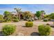 Inviting front yard with lush landscaping and a charming walkway leading to the entrance of this beautiful single-story home at 21384 E Excelsior Ave, Queen Creek, AZ 85142