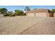 Three car garage with neutral color and a large brick driveway at 21384 E Excelsior Ave, Queen Creek, AZ 85142