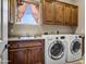 Laundry room featuring a washer, dryer, sink and cabinets at 21384 E Excelsior Ave, Queen Creek, AZ 85142