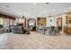 Spacious living area featuring tile floors, a cozy fireplace, and bar seating perfect for entertaining friends and Gathering at 21384 E Excelsior Ave, Queen Creek, AZ 85142