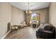 Cozy sitting room with warm lighting, a decorative chandelier, and comfortable seating for relaxation and conversation at 21384 E Excelsior Ave, Queen Creek, AZ 85142