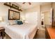 Cozy bedroom with soft decor, natural light from a window and closet access at 2171 E Iris Dr, Chandler, AZ 85286