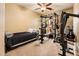 Multi-purpose bedroom features a weight rack and a bed at 2171 E Iris Dr, Chandler, AZ 85286