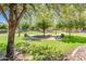 Inviting community park with benches, trash cans, and lush greenery, perfect for relaxing and enjoying the outdoors at 2171 E Iris Dr, Chandler, AZ 85286