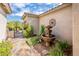 Stylish courtyard with decorative fountain, stone accents, and desert landscaping at 2171 E Iris Dr, Chandler, AZ 85286