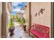 Cozy front porch with decorative red bench and potted plants, creating a welcoming entrance at 2171 E Iris Dr, Chandler, AZ 85286