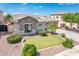 Landscaped front yard showcasing manicured lawn and stone detail on exterior at 2171 E Iris Dr, Chandler, AZ 85286
