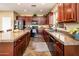 Modern kitchen featuring sleek appliances, granite countertops, and plenty of cabinet space at 2171 E Iris Dr, Chandler, AZ 85286