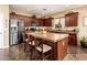 Stylish kitchen featuring granite countertops, stainless steel appliances, and a functional island at 2171 E Iris Dr, Chandler, AZ 85286