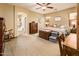 Comfortable main bedroom suite boasts an ensuite bathroom, natural light, and neutral color scheme at 2171 E Iris Dr, Chandler, AZ 85286