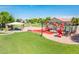 Community playground with slides, picnic tables, and green space at 2171 E Iris Dr, Chandler, AZ 85286