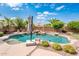 Beautiful backyard pool with waterfall feature and lush landscaping at 2171 E Iris Dr, Chandler, AZ 85286