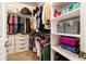 Walk-in closet is well organized and features ample shelving and storage for clothing and accessories at 2171 E Iris Dr, Chandler, AZ 85286