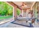Relaxing patio with an outdoor fan, and a sliding barn door, perfect for entertaining at 2383 E Zion Way, Chandler, AZ 85249