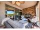 Outdoor living space with stone fireplace, comfortable seating, and direct access to the main house at 2383 E Zion Way, Chandler, AZ 85249