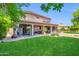 Expansive backyard with covered patio and lush greenery, ideal for outdoor living at 2383 E Zion Way, Chandler, AZ 85249