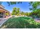Spacious backyard with desert landscaping and covered patio at 2383 E Zion Way, Chandler, AZ 85249