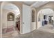 Hallway view of the primary bath with a vanity and mirror and decorative architecture at 2383 E Zion Way, Chandler, AZ 85249