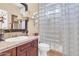 Cozy bathroom featuring a glass block shower, a vanity sink, and decorative accents at 2383 E Zion Way, Chandler, AZ 85249