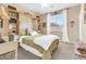 Cozy bedroom featuring built-in bookshelves, a comfortable bed, and a bright window at 2383 E Zion Way, Chandler, AZ 85249