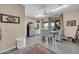 Cozy dining area features lots of space, stainless steel fridge, and seamless view to back patio at 2383 E Zion Way, Chandler, AZ 85249