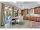 Bright dining area adjacent to kitchen with ample cabinetry and convenient access to the backyard at 2383 E Zion Way, Chandler, AZ 85249