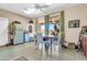 Bright dining room featuring a table with seating for four, a ceiling fan, and a view of the patio at 2383 E Zion Way, Chandler, AZ 85249