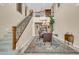 Elegant dining room features a chandelier, custom rug, and an adjacent staircase at 2383 E Zion Way, Chandler, AZ 85249