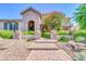 Welcoming entrance with stone archway, manicured greenery, and brick stairs at 2383 E Zion Way, Chandler, AZ 85249