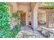 Inviting entryway featuring a stone archway and beautiful wooden front door at 2383 E Zion Way, Chandler, AZ 85249