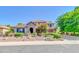 Charming two-story home featuring a stone-accented facade, landscaped yard, and inviting entrance at 2383 E Zion Way, Chandler, AZ 85249