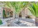 Charming front porch featuring stone accents, a seating area, and a beautifully landscaped garden at 2383 E Zion Way, Chandler, AZ 85249