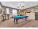 Entertaining game room featuring a pool table, custom bar area, and vibrant wall decor at 2383 E Zion Way, Chandler, AZ 85249